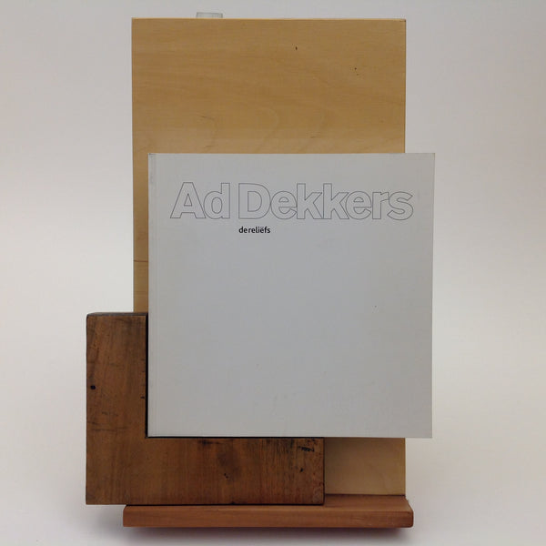 AD DEKKERS. Ad Dekkers - De Reliefs . Gorkum: Gorcums Museum, 2009. 1st Edition. 200 x 200 Mm. Paperback. As New ISBN: 9789078251033. Pages unnumbered, illustrated in B&W and some colour plates. Text in Dutch by Piet Augustijn. - Ad Dekkers - De Reliefs